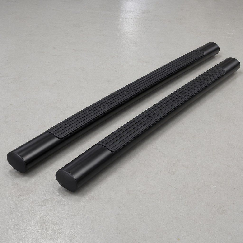 Pair of 60-inch black oval side steps on a concrete shop floor