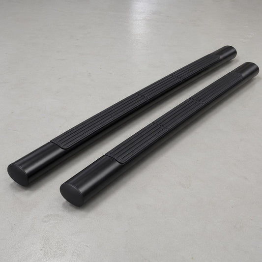 Pair of 60-inch black oval side steps on a concrete shop floor