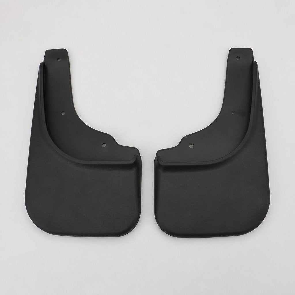 Pair of black rubber rear splash guards standing on a shop floor