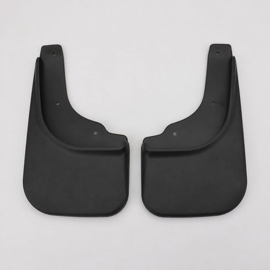 Pair of black rubber rear splash guards standing on a shop floor